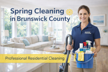 Professional cleaner in navy polo and khaki pants providing spring cleaning in a bright Brunswick County NC home